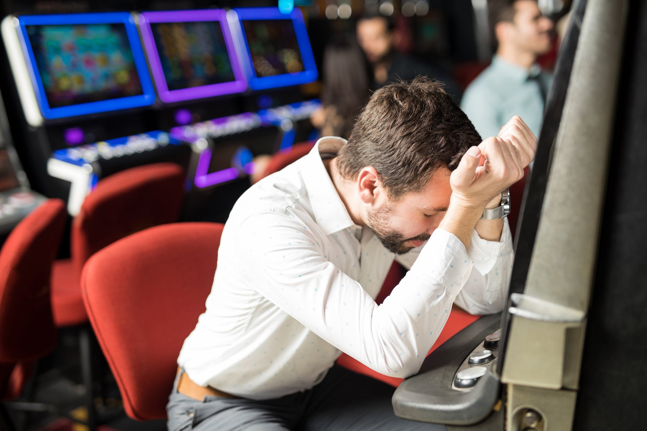 Unhappy man at slot machine