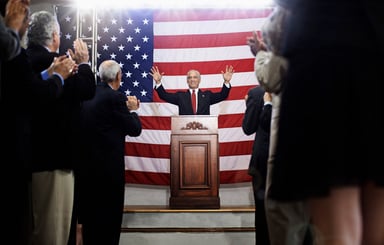 A politician making a speech at a podium.