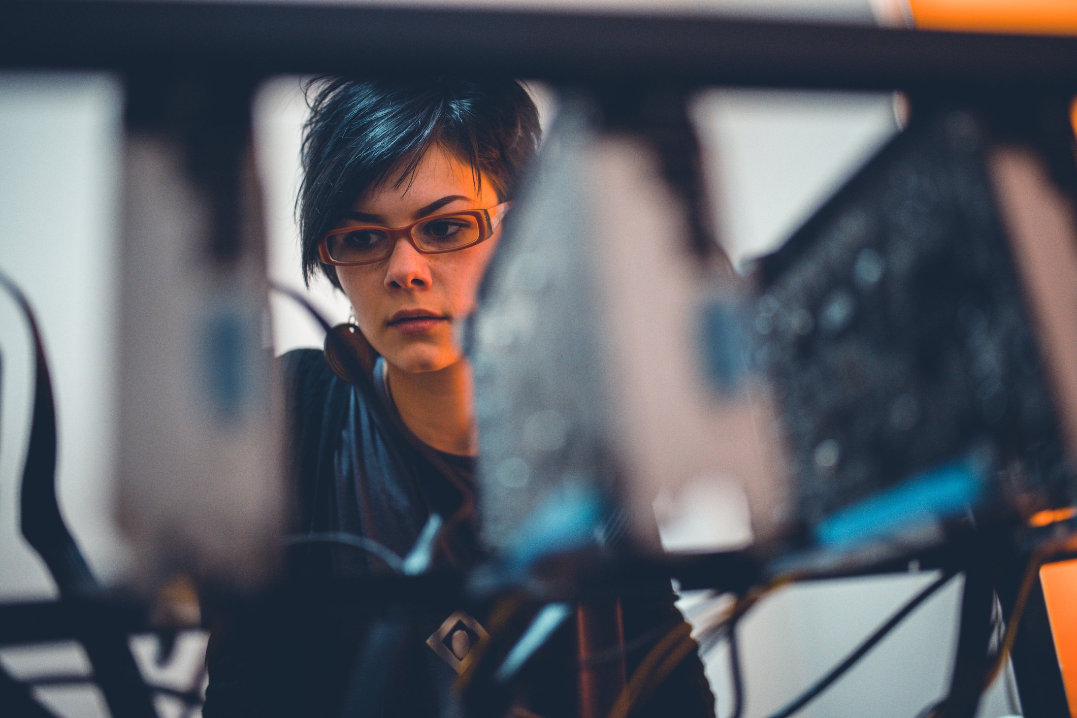 Person inspecting a rack of GPUs