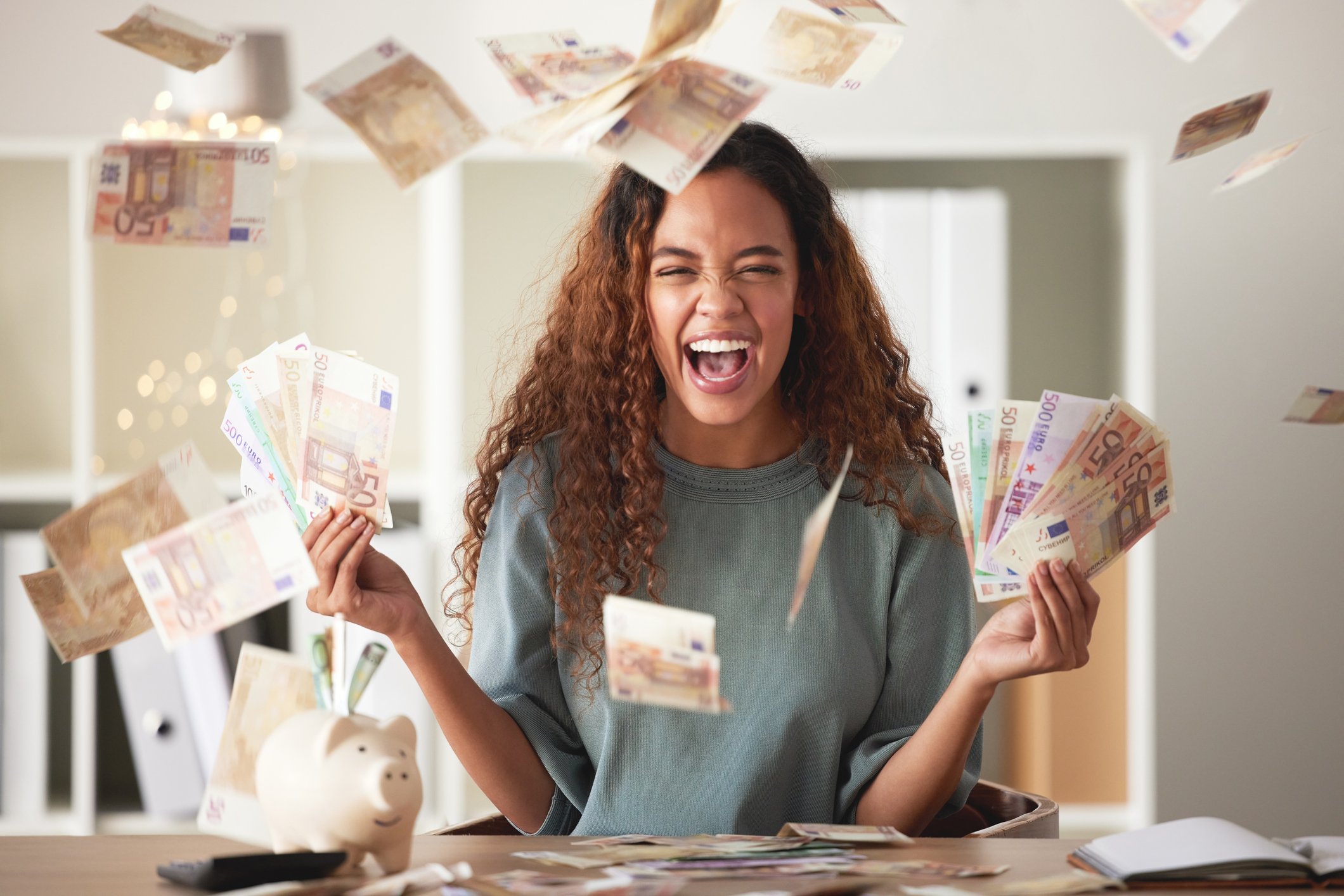 A happy person with dollar notes.