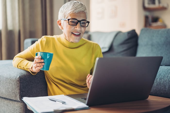 A person at a laptop.