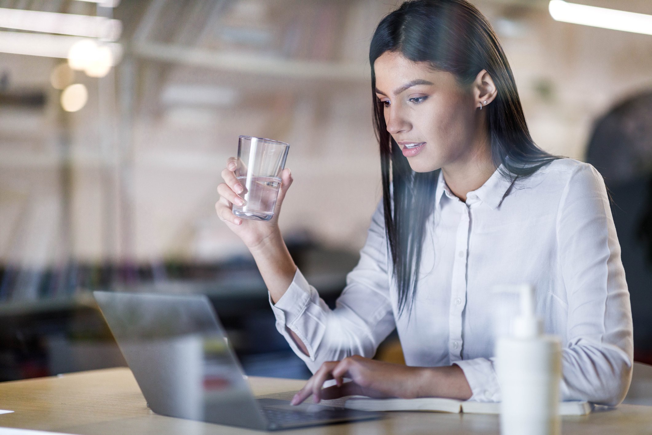 A person sitting at a computer. 