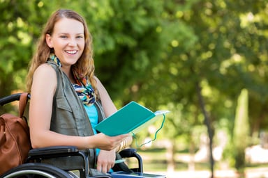 Getty - wheelchair reading happy smiling