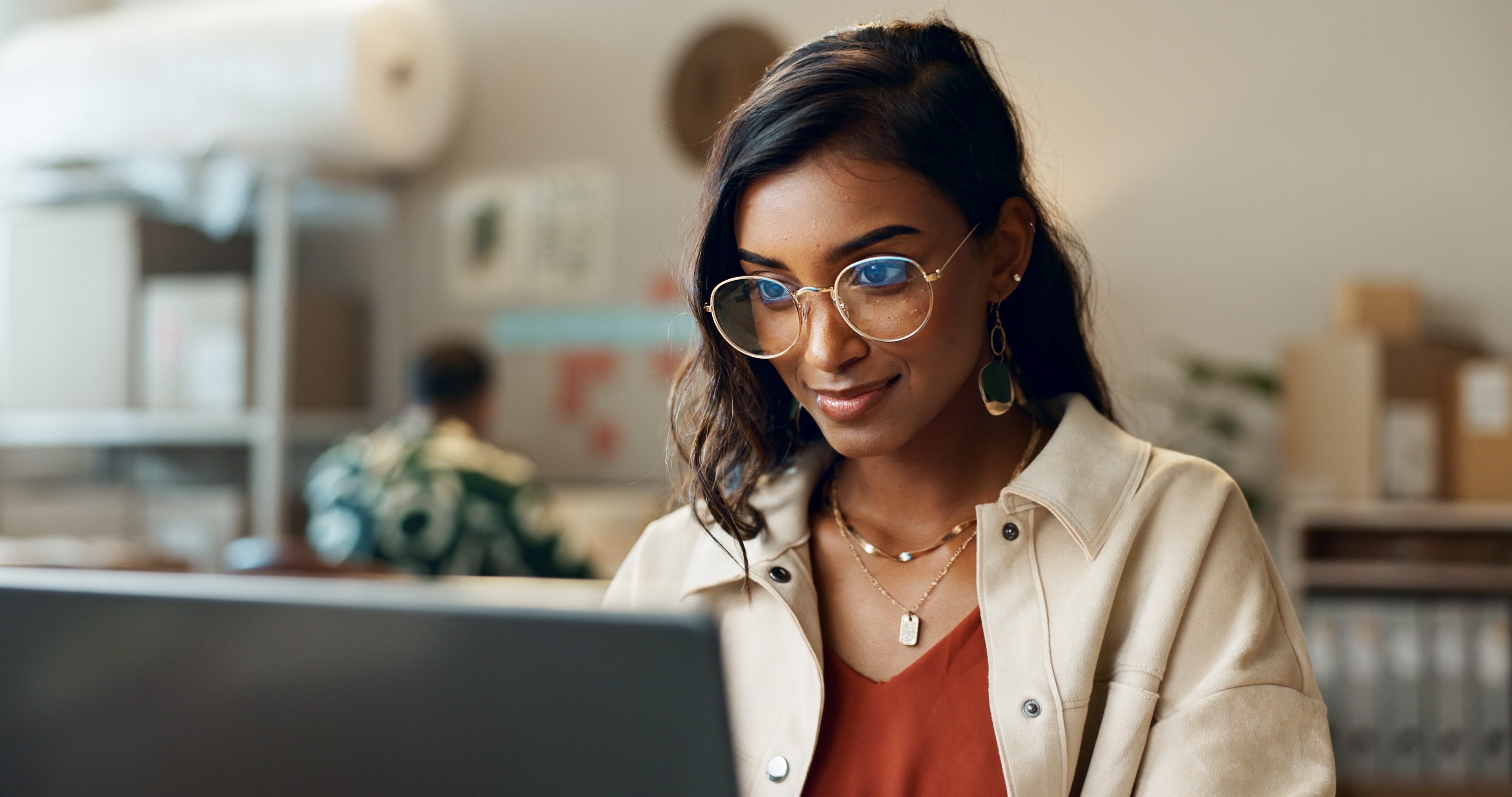 Person peering at computer