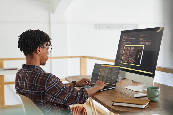 A person at a desk using a computer.