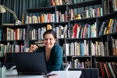 Person sitting at a desk looking at a computer