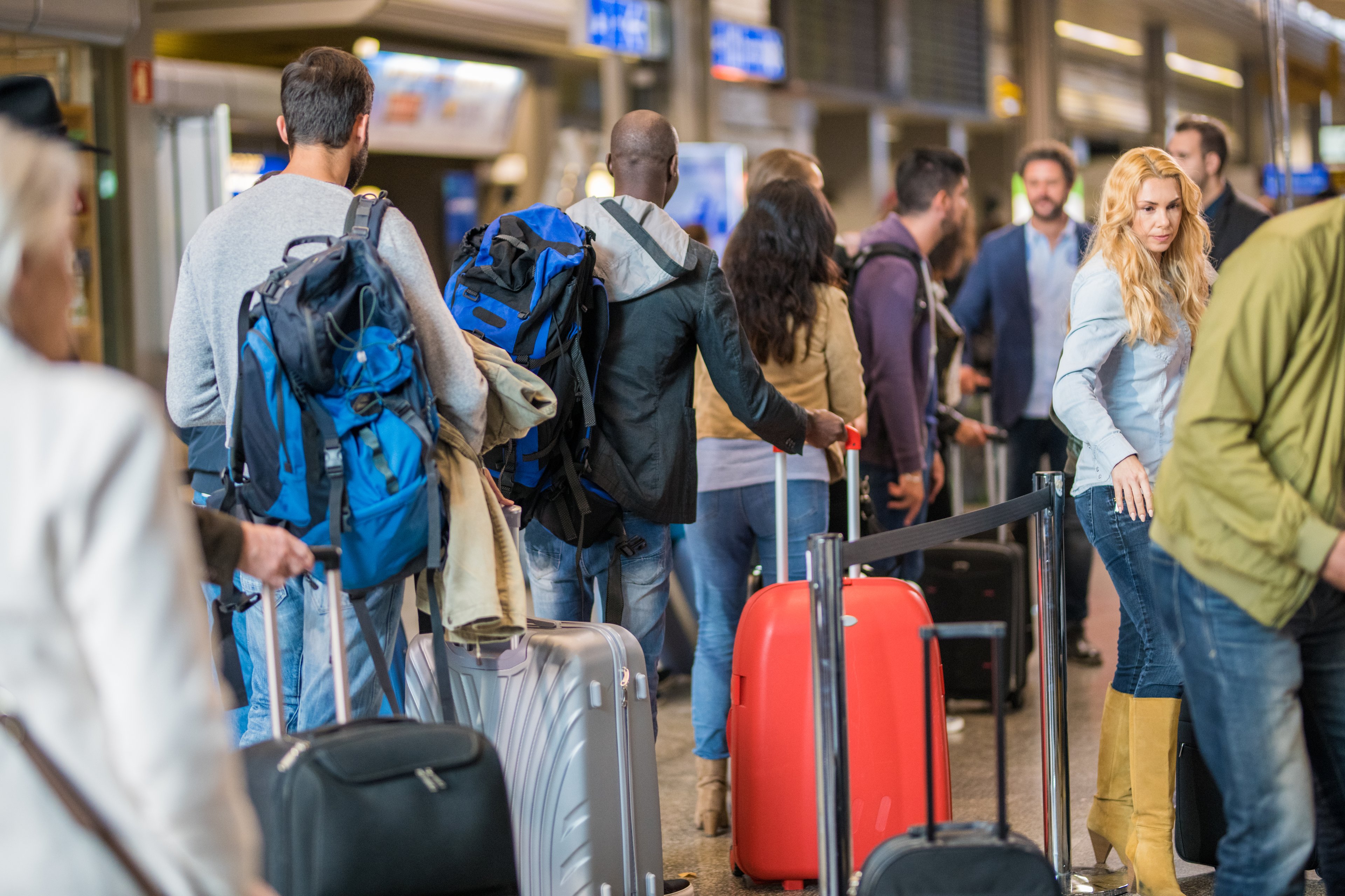 crowded airport delays canceled flights busy
