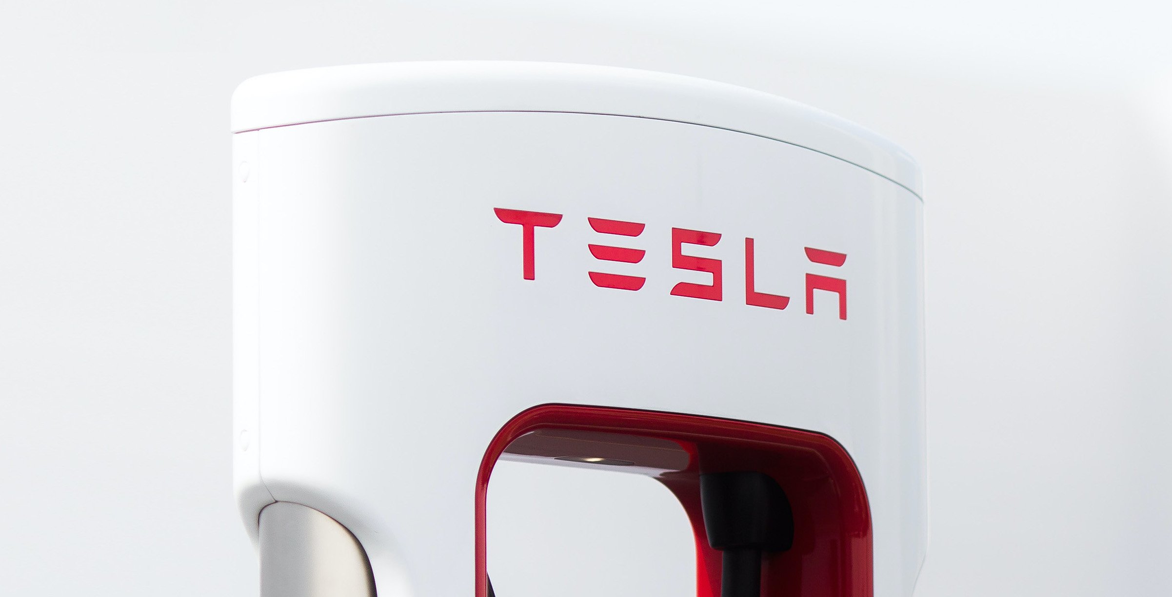 A Tesla logo on an electric vehicle charger. 
