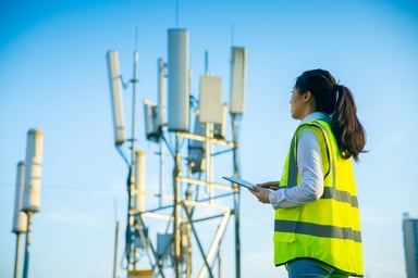 Technician working at a communications tower.