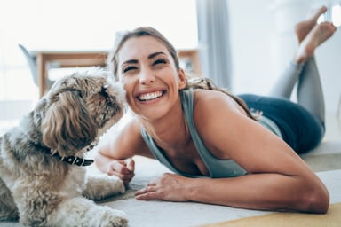 Getty - smiling happy with dog yoga pants
