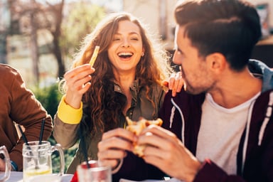 Several young people enjoying a meal