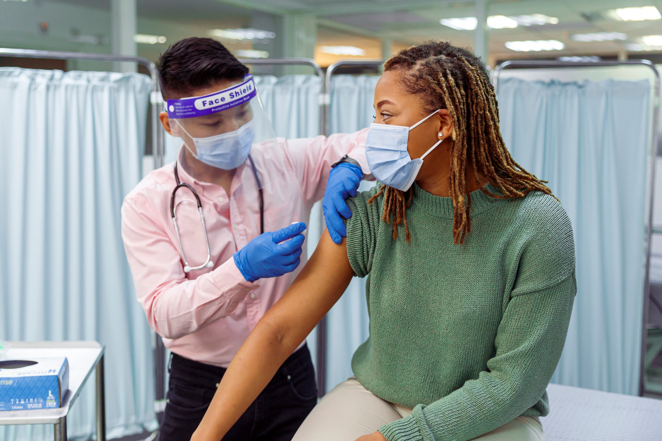 doctor vaccinating a patient