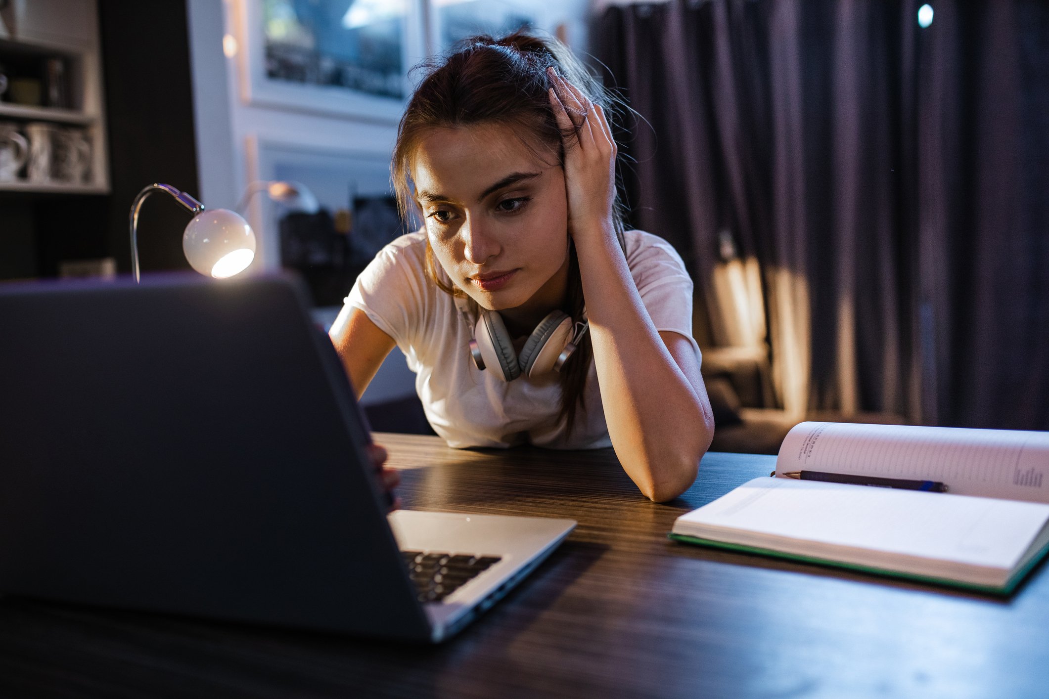Concerned person looking at a laptop screen