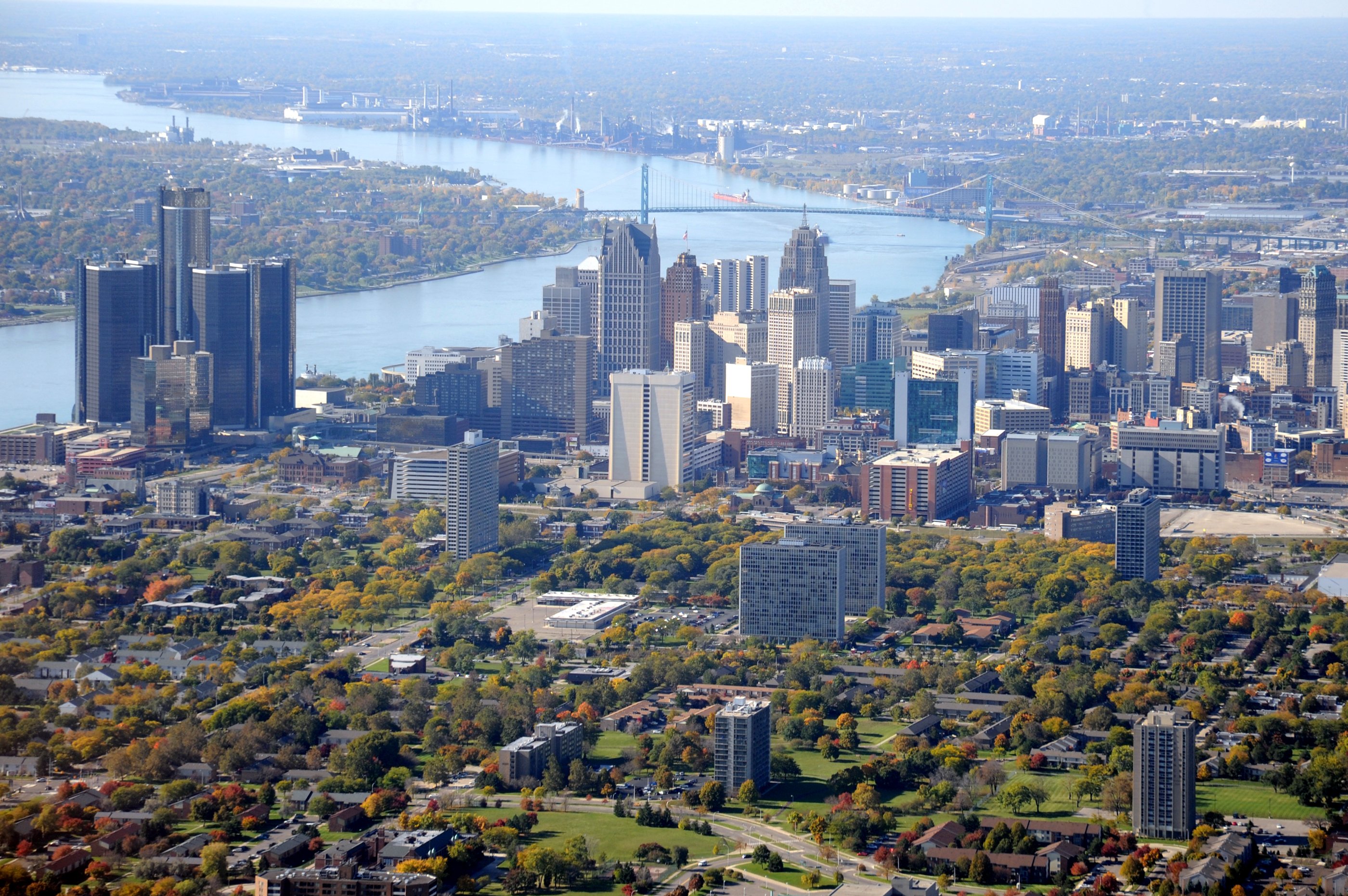 A picture of Detroit's skyline including a river in the background.