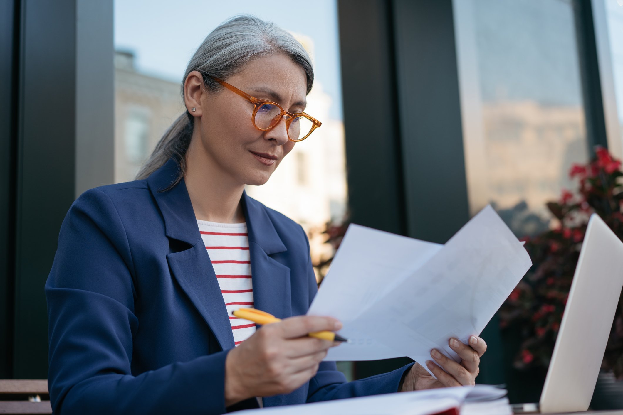 Mature businessperson reading documents