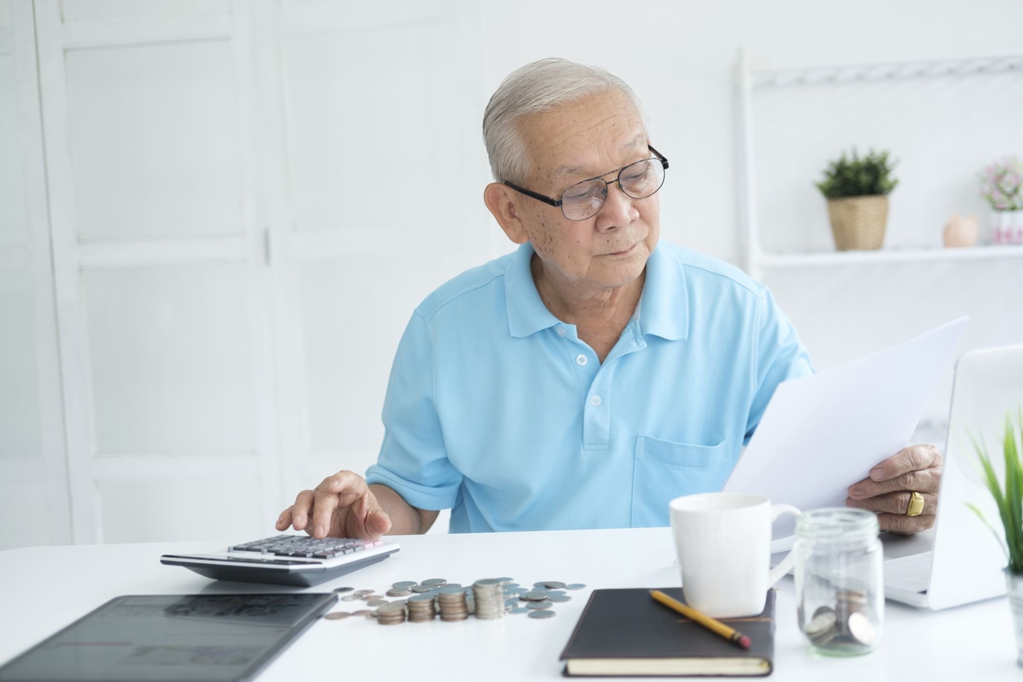 A person calculating their finances.