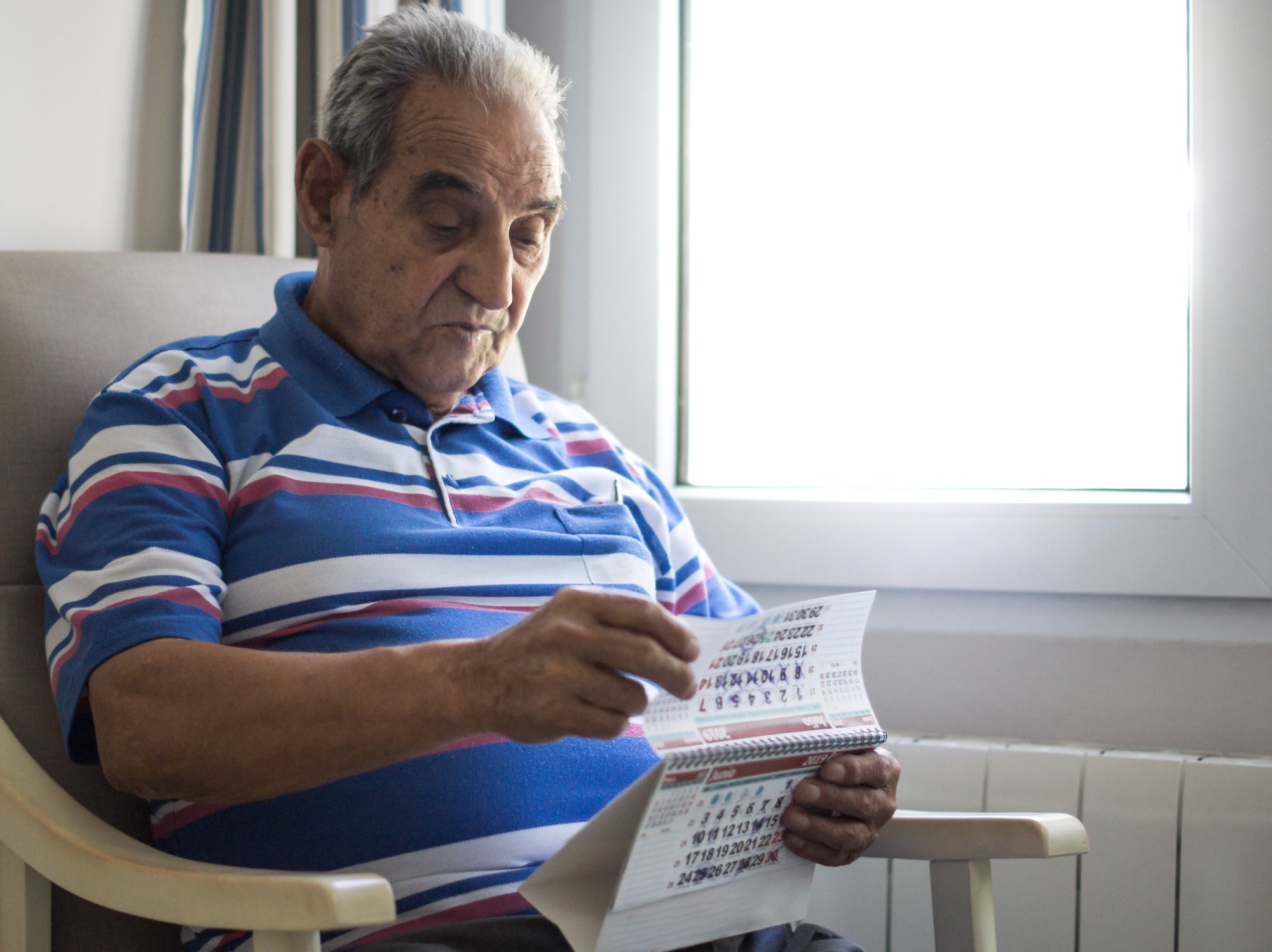 A person looking at a calendar.
