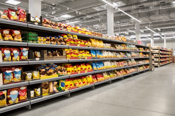 Snacks on a shelf in a store.