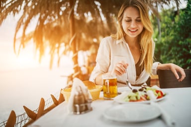 Lady Eating Salad by the Beach