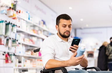 Pharmacy customers checking price on phone