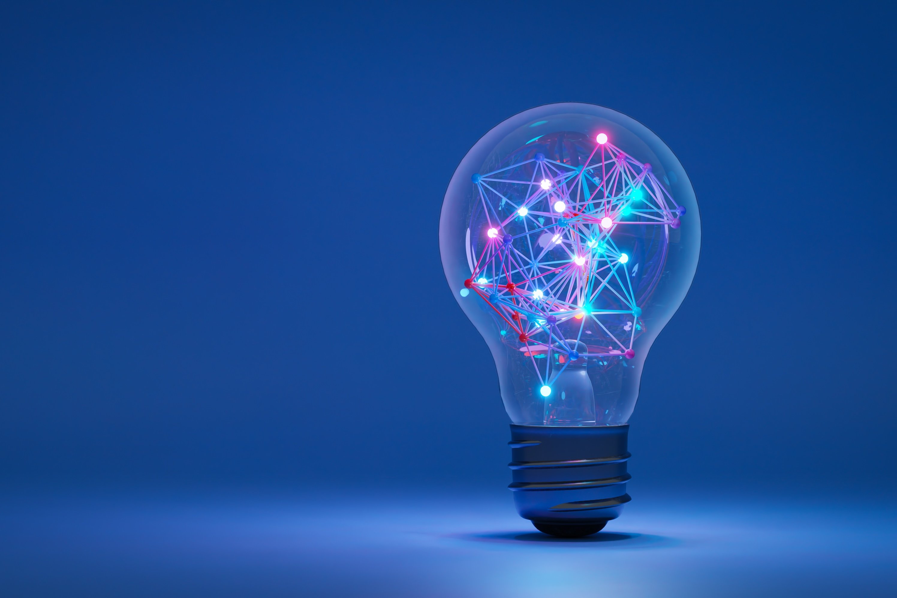 A lightbulb filled with glowing filaments.