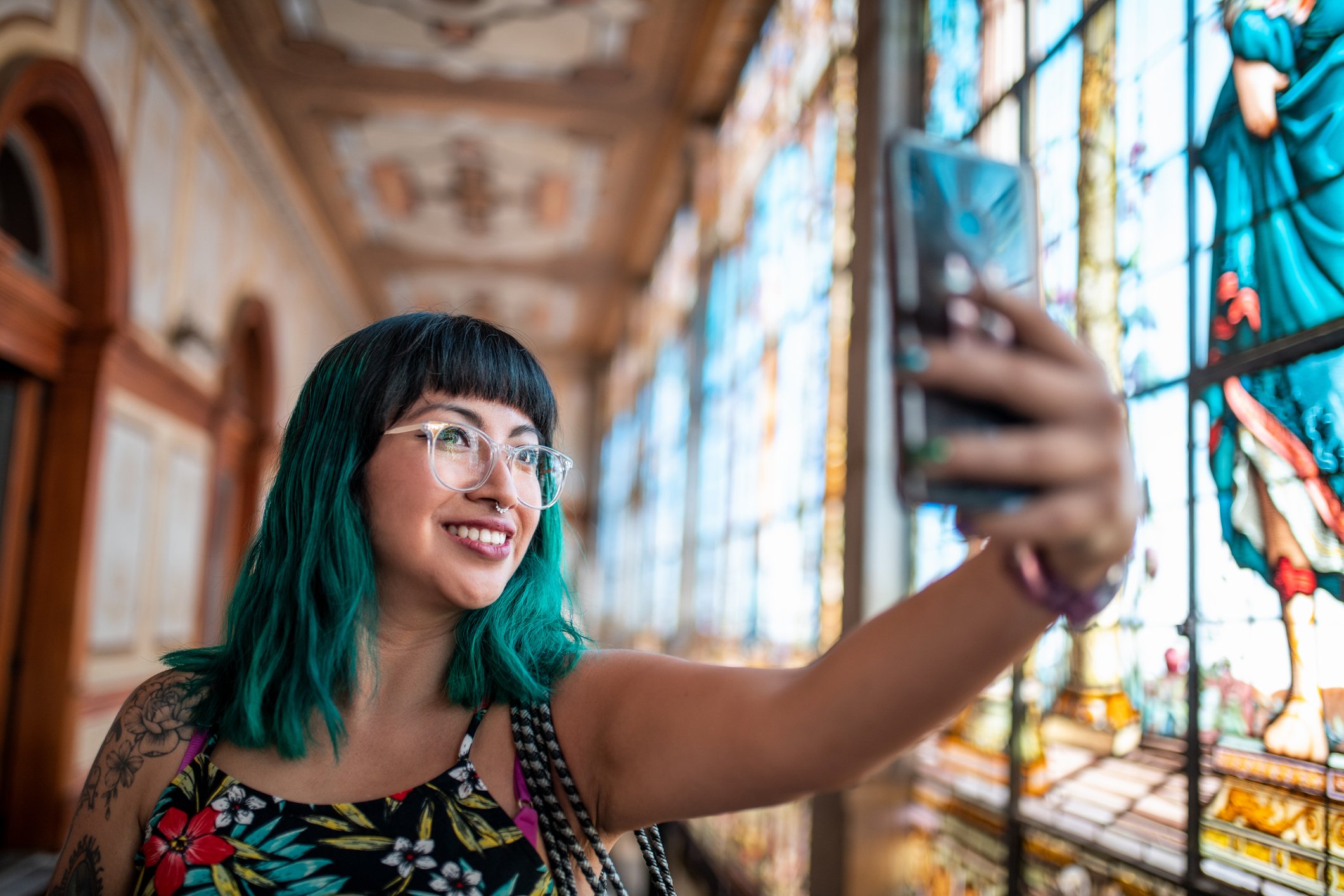 person takes selfie in ornate place of worship