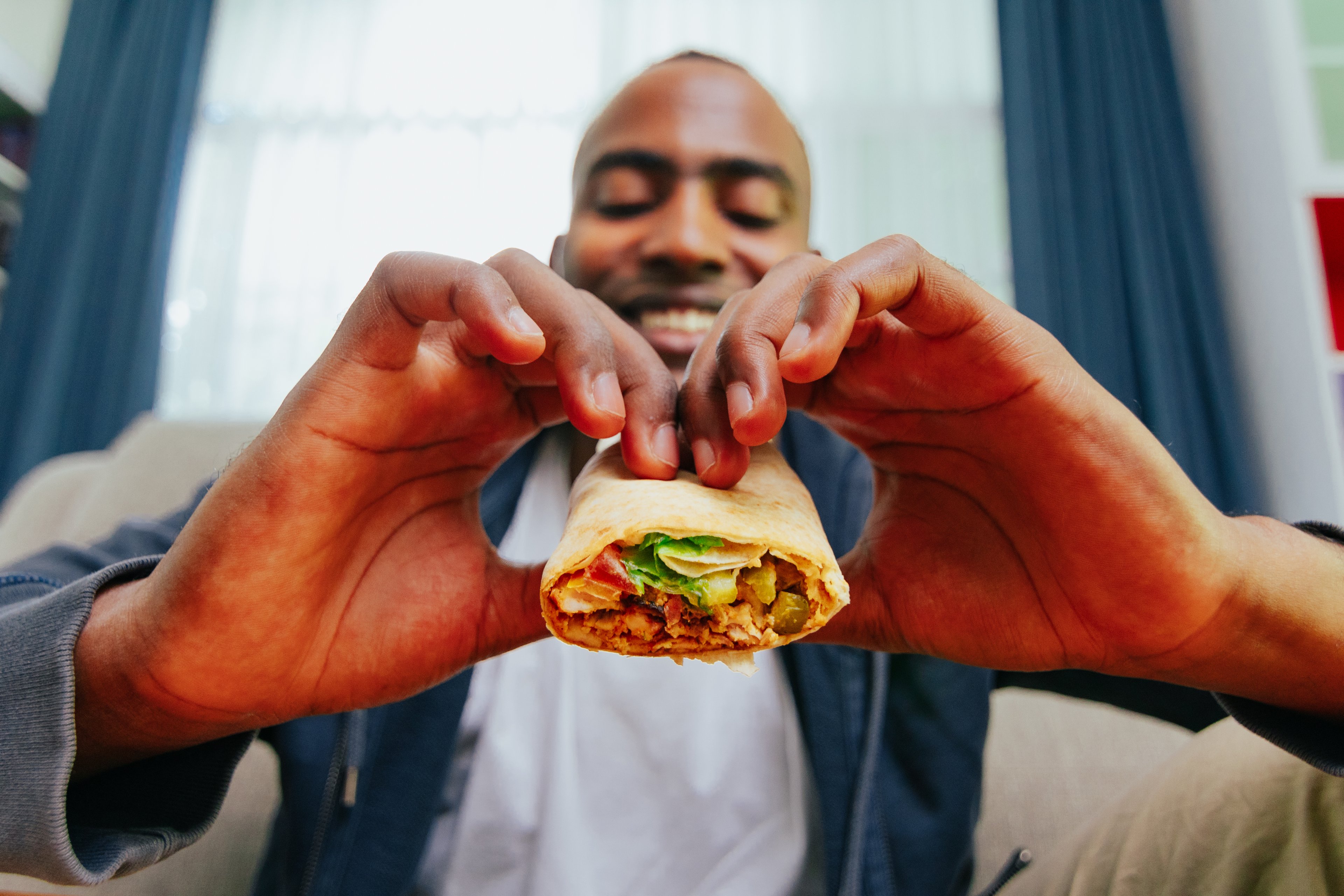 Man Eating Burrito