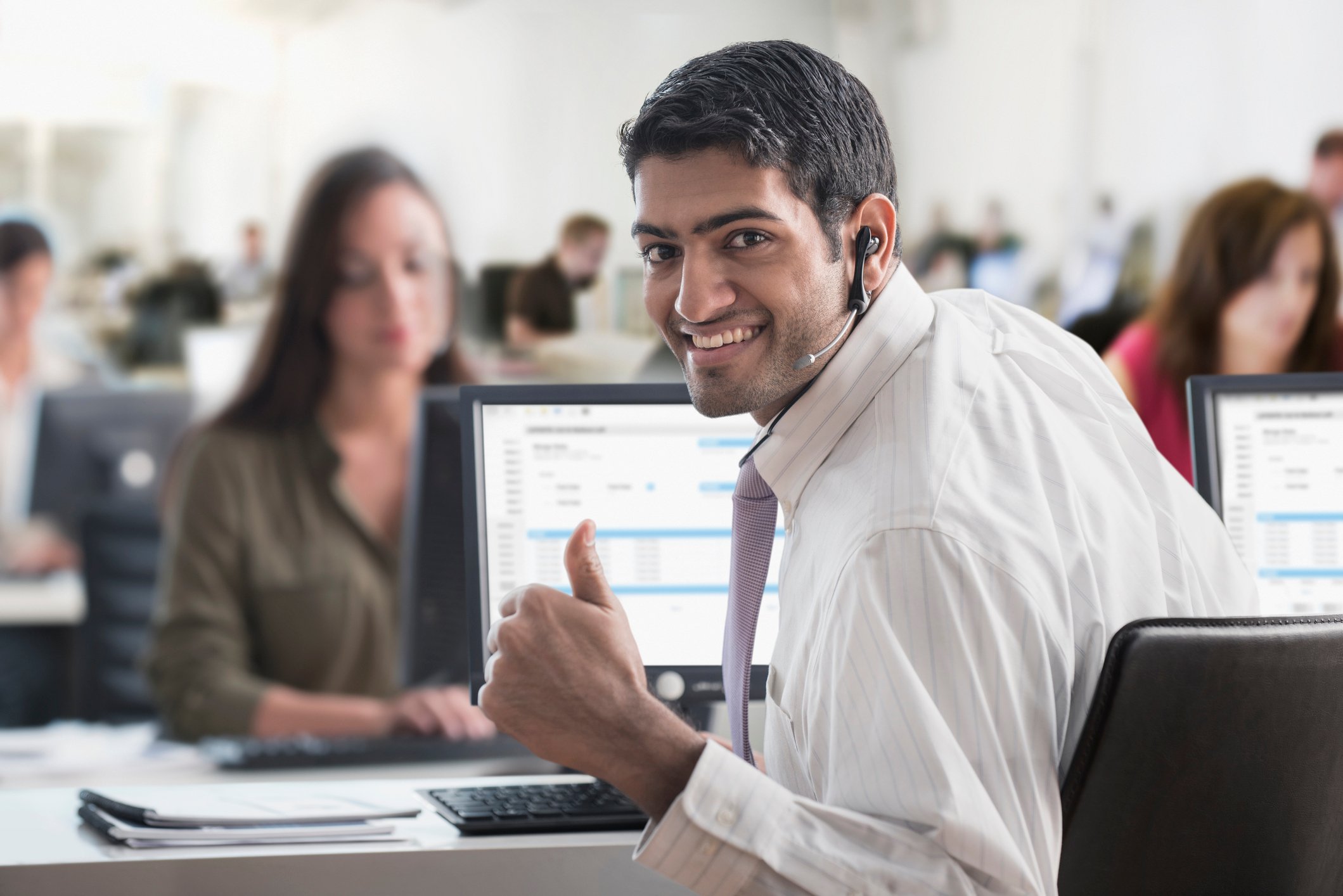 Business person giving a thumbs up.