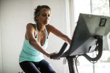 a person on an exercise bike