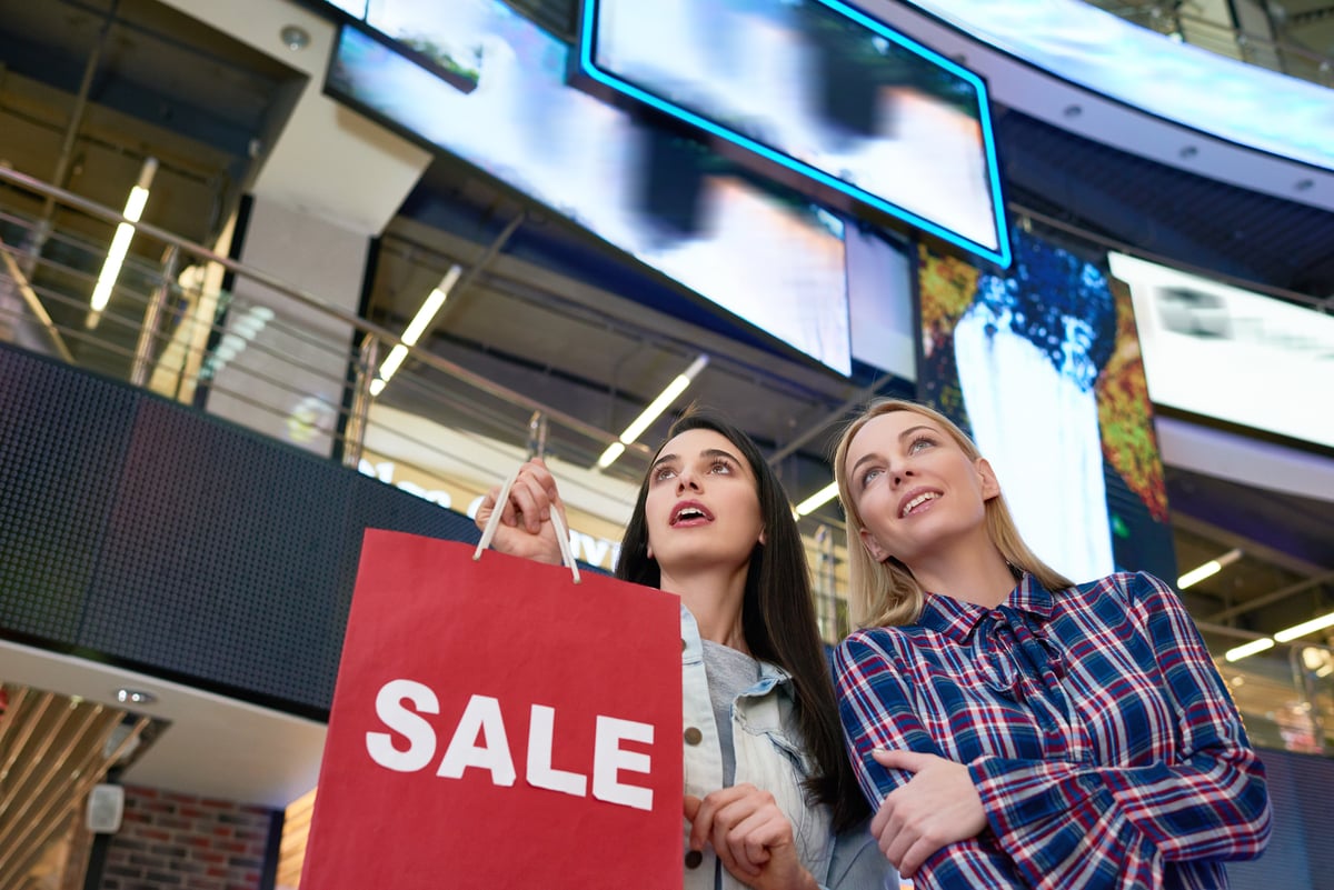 Two people in a shopping mall.