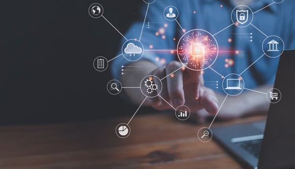 A person interacting with a digital projection.