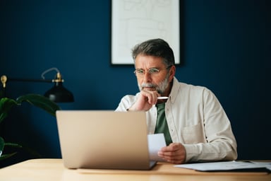 Older man laptop GettyImages-1458504270