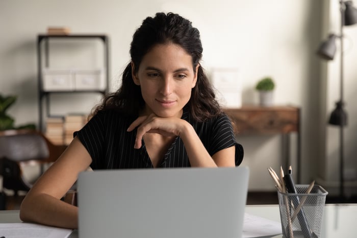 A person at a laptop.