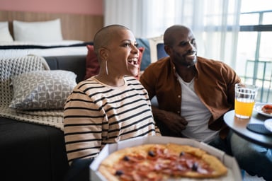 Couple enjoying quick service pizza