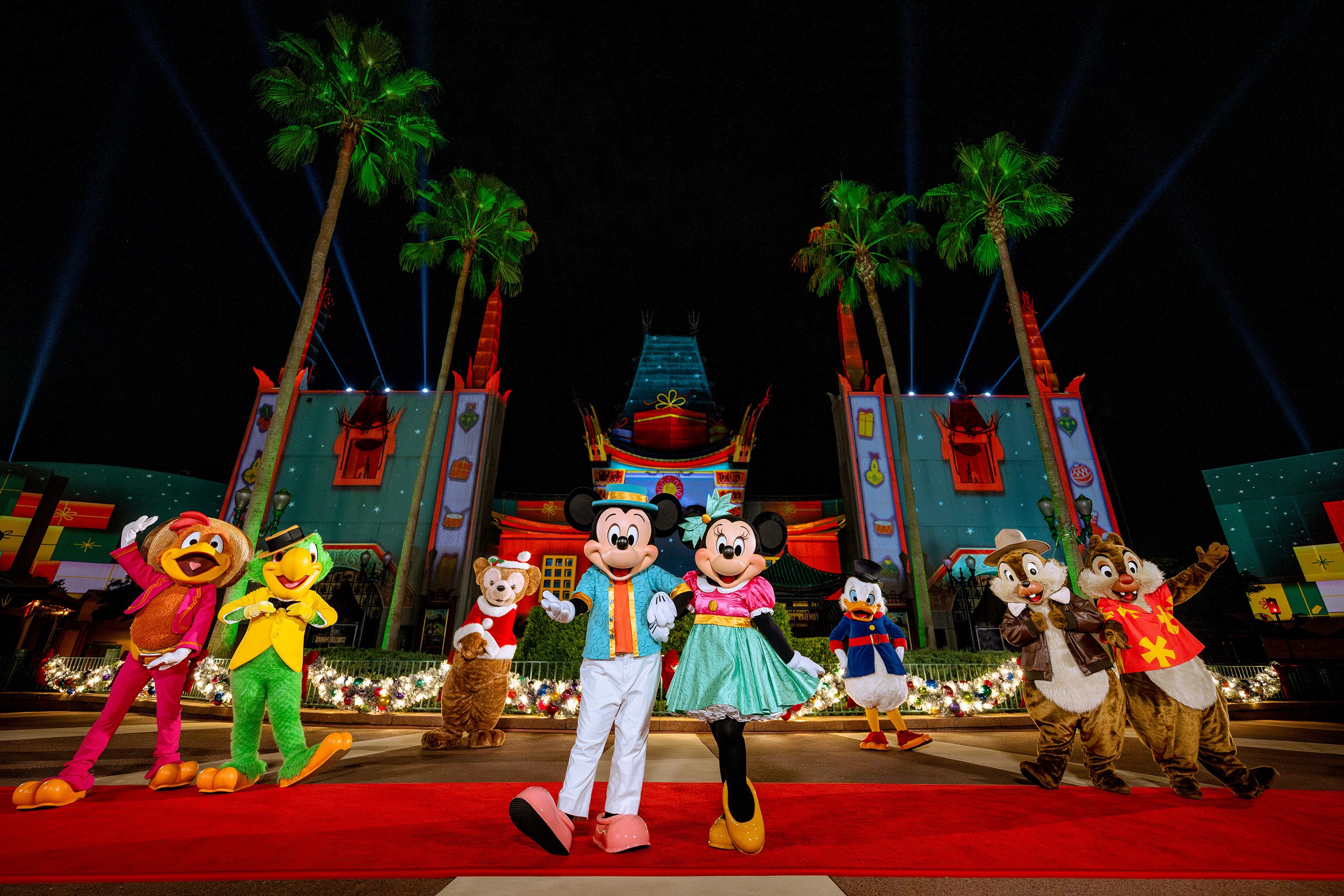Mickey Mouse, Minnie Mouse, and friends celebrating the holidays at Disney's Hollywood Studios in Florida.
