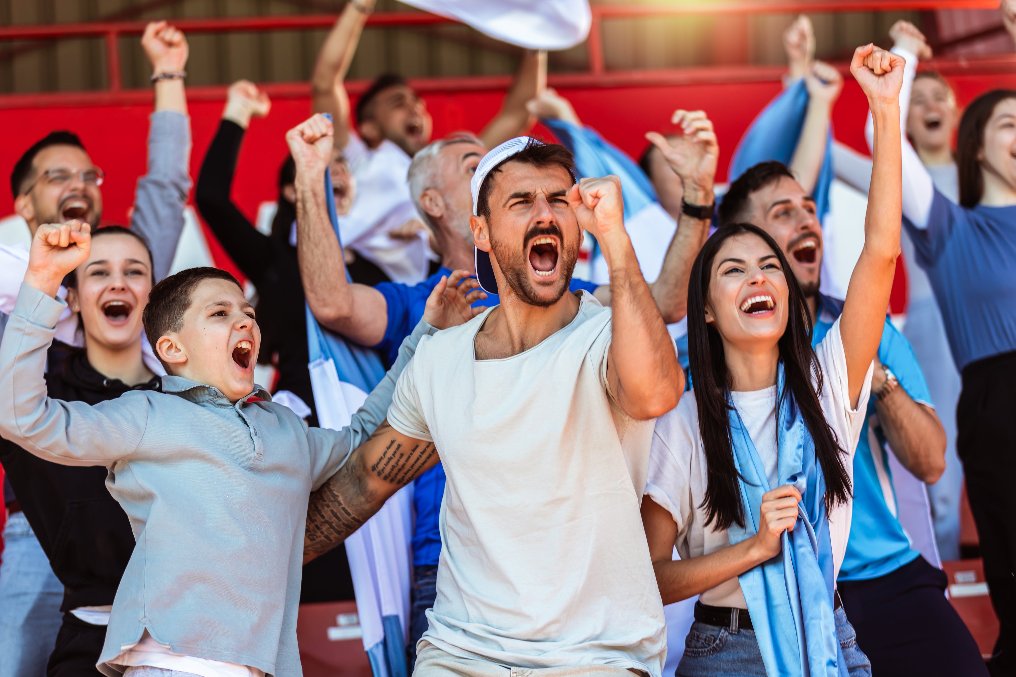 Fans cheering during a game. 