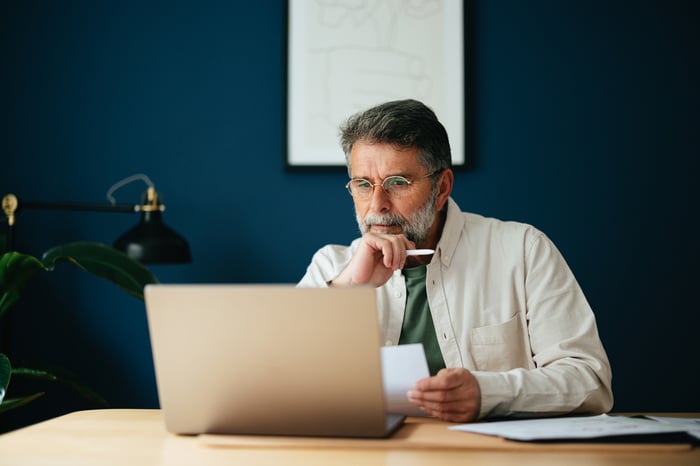 A person at a laptop.