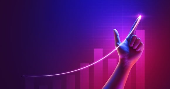 An upward trending luminous line traced by a finger.