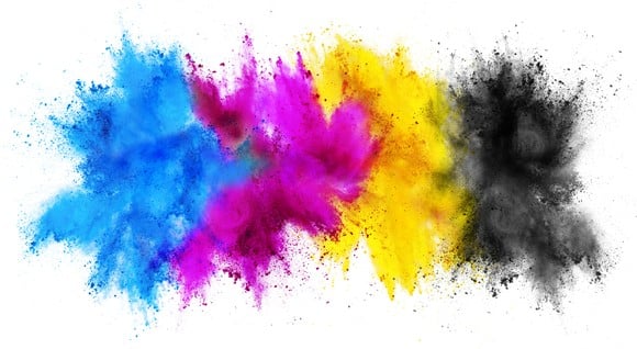 Bursts of blue, pink, yellow, and black powder with a white background.