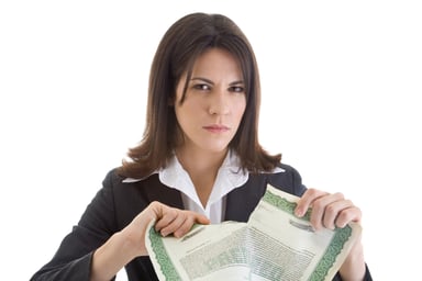 Investor tears stock certificate in half