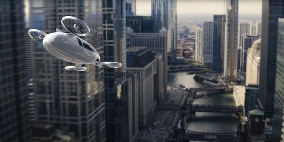 An eVTOL aircraft flying through a city.
