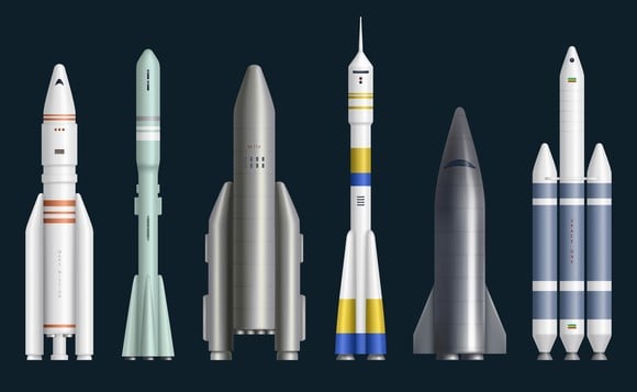 Various rocket models stand in a line.