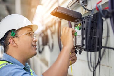 Technician setting up a modem.