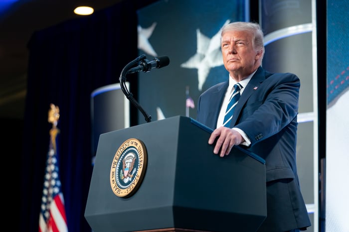 Donald Trump delivering remarks from behind the presidential podium.