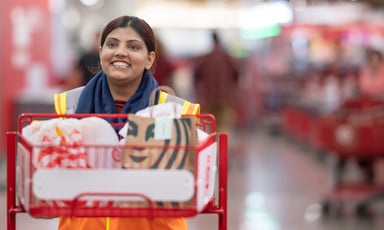 _target employee with starbucks bag in cart_target_