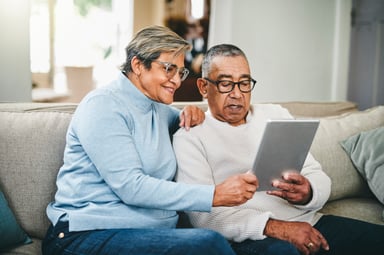 senior couple using a digital tablet at home