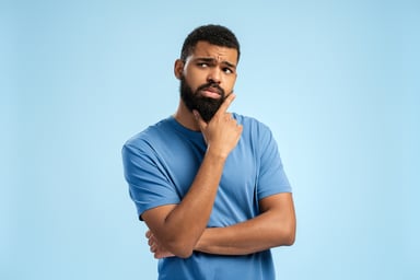 Person thinking with finger on chin 2149593400