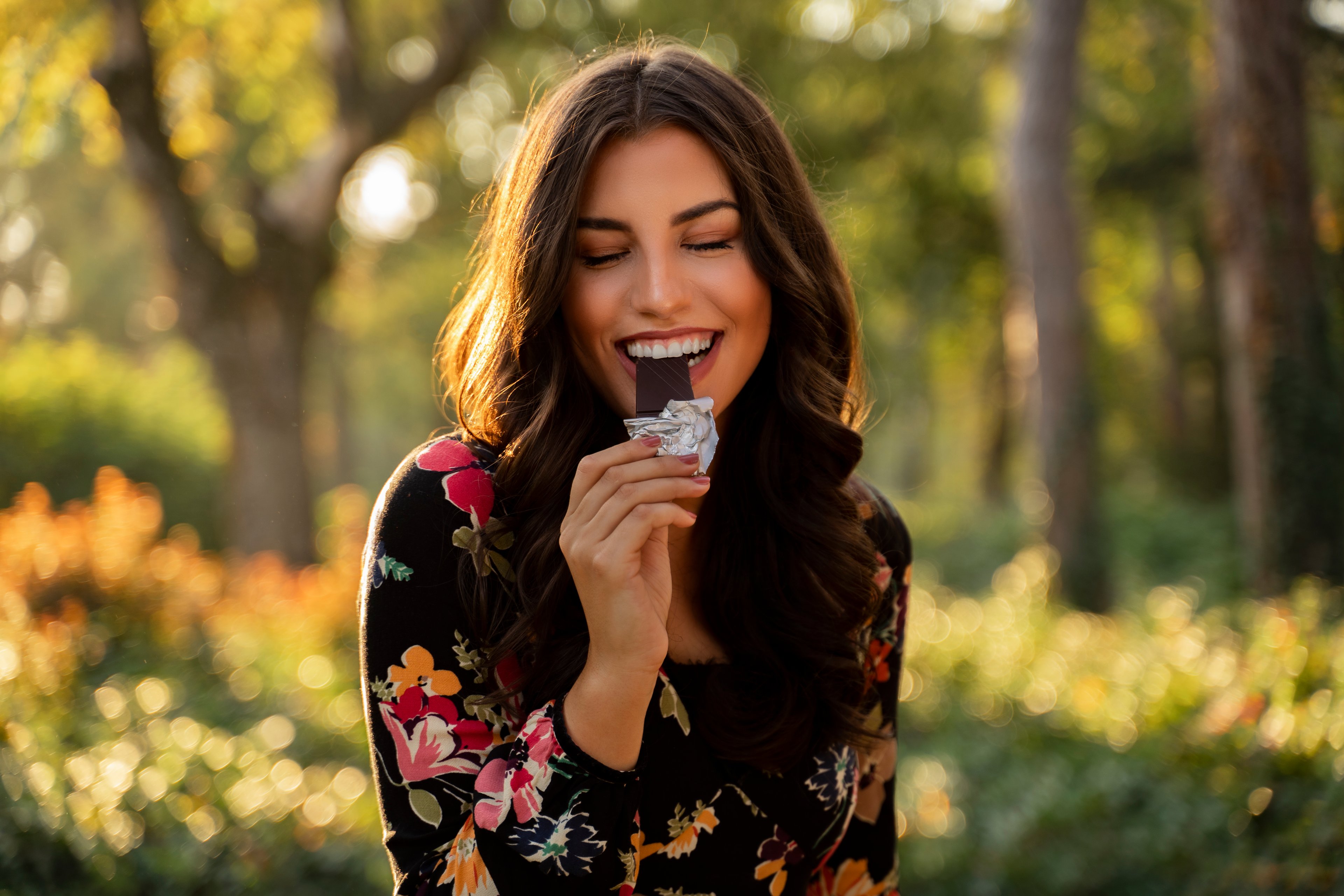 woman eats a chocolate bar