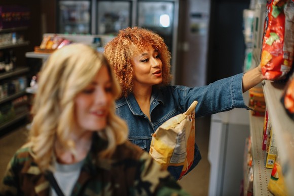 Two people shopping in a store.