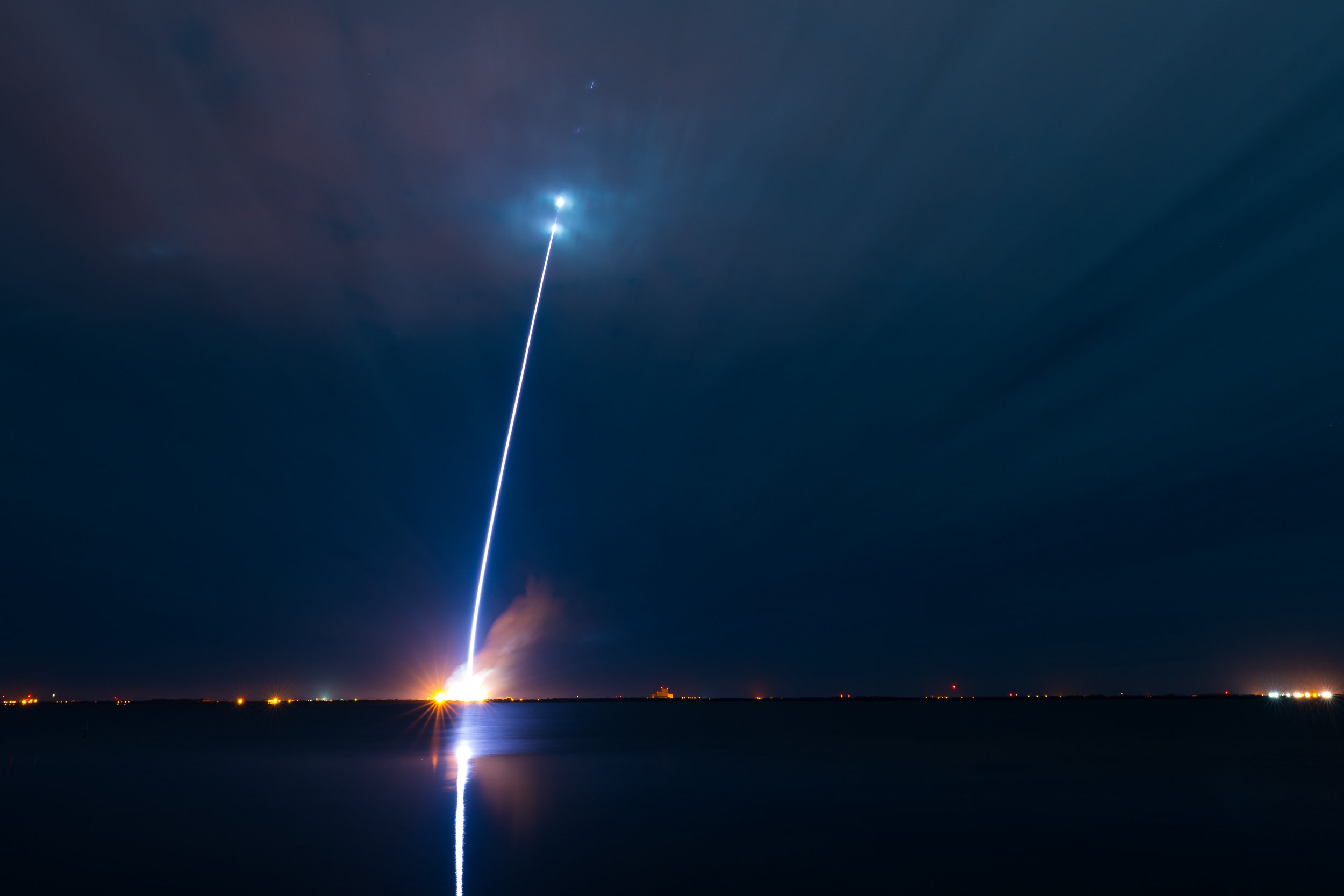 The Jan. 16 New Glenn rocket launch, seen over water at night.